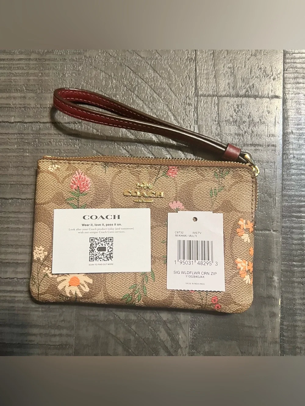 COACH Brown Floral Signature Wristlet with Burgundy Strap